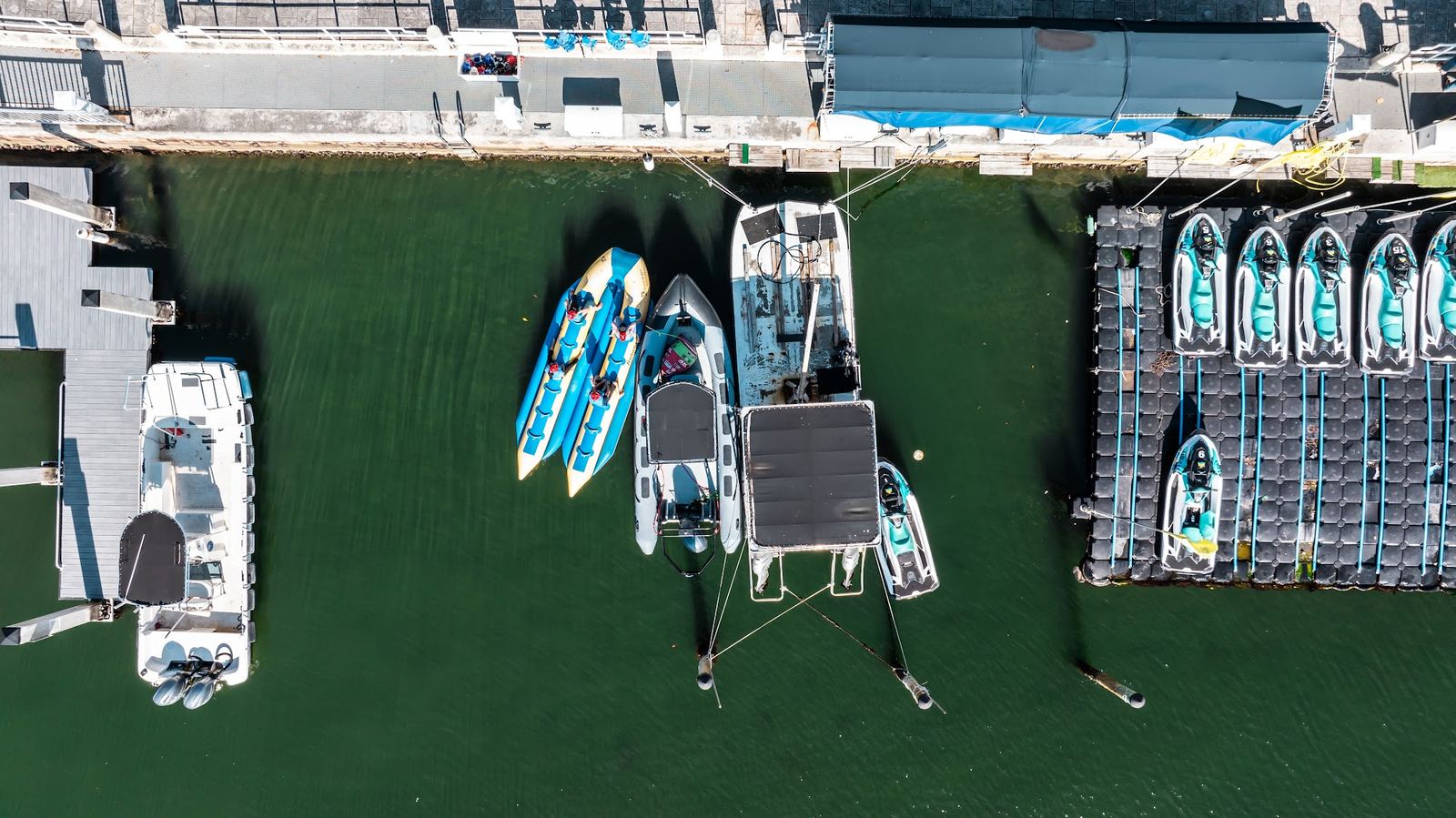 The jet ski fleet and boats seen from above at the dock