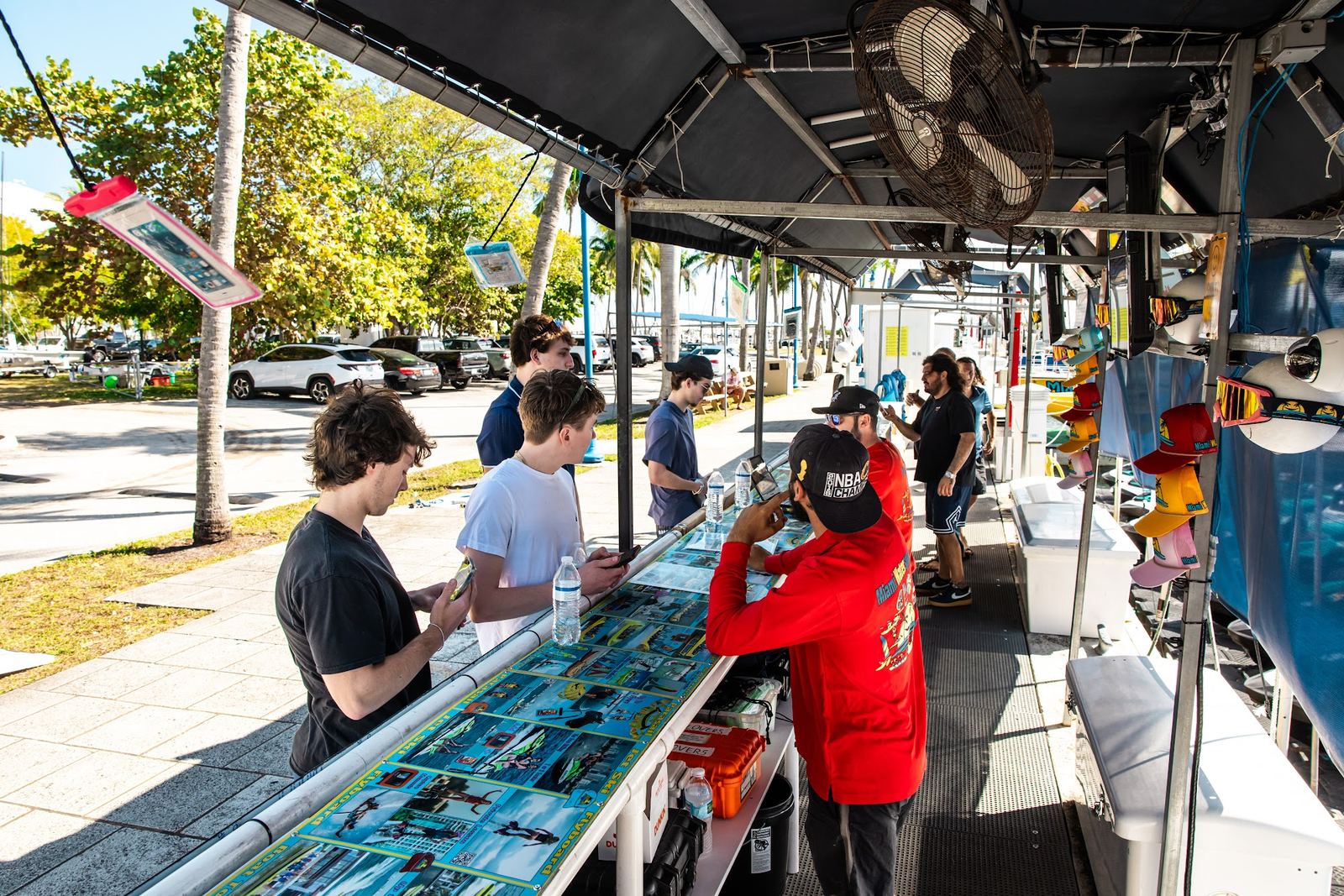 Staff checking guests in under the canopy