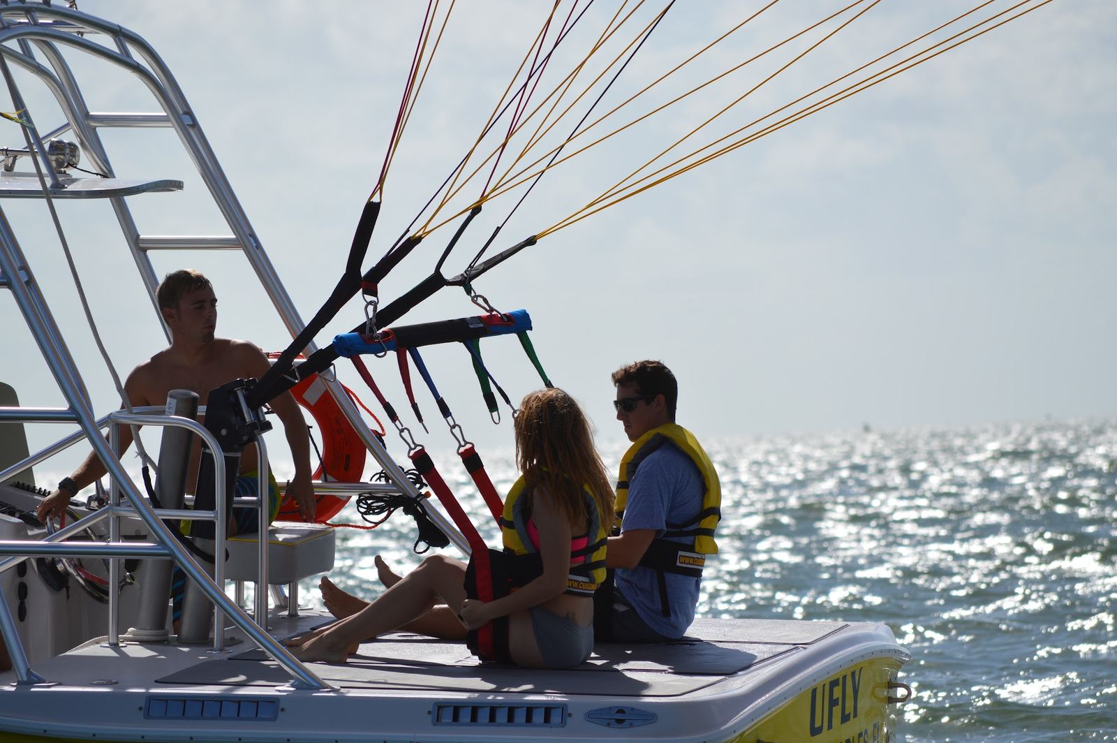 Flyers sitting on the parasail boat's flight deck before takeoff